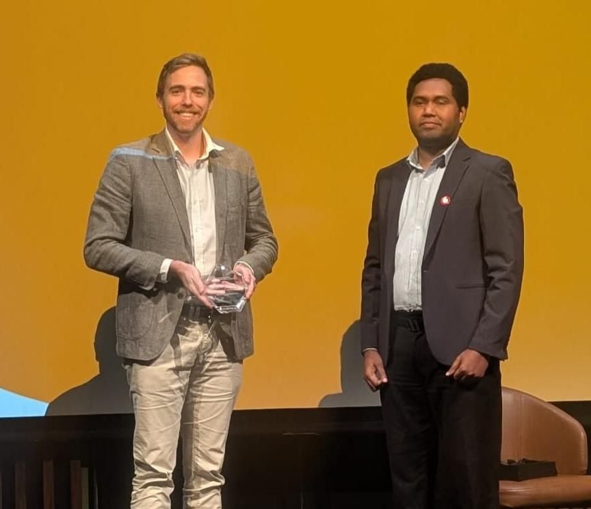 NiuPay receiving the Innovation PNG Award for Corporate Innovation on stage in Port Moresby, June 2026