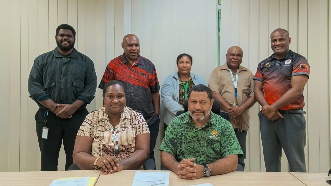 NiuPay and Office of Workers' Compensation staff at the contract signing in Port Moresby, October 2026