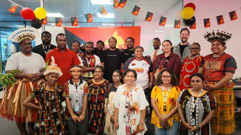 The NiuPay team in Port Moresby, many in traditional dress, celebrating Independence in September 2026